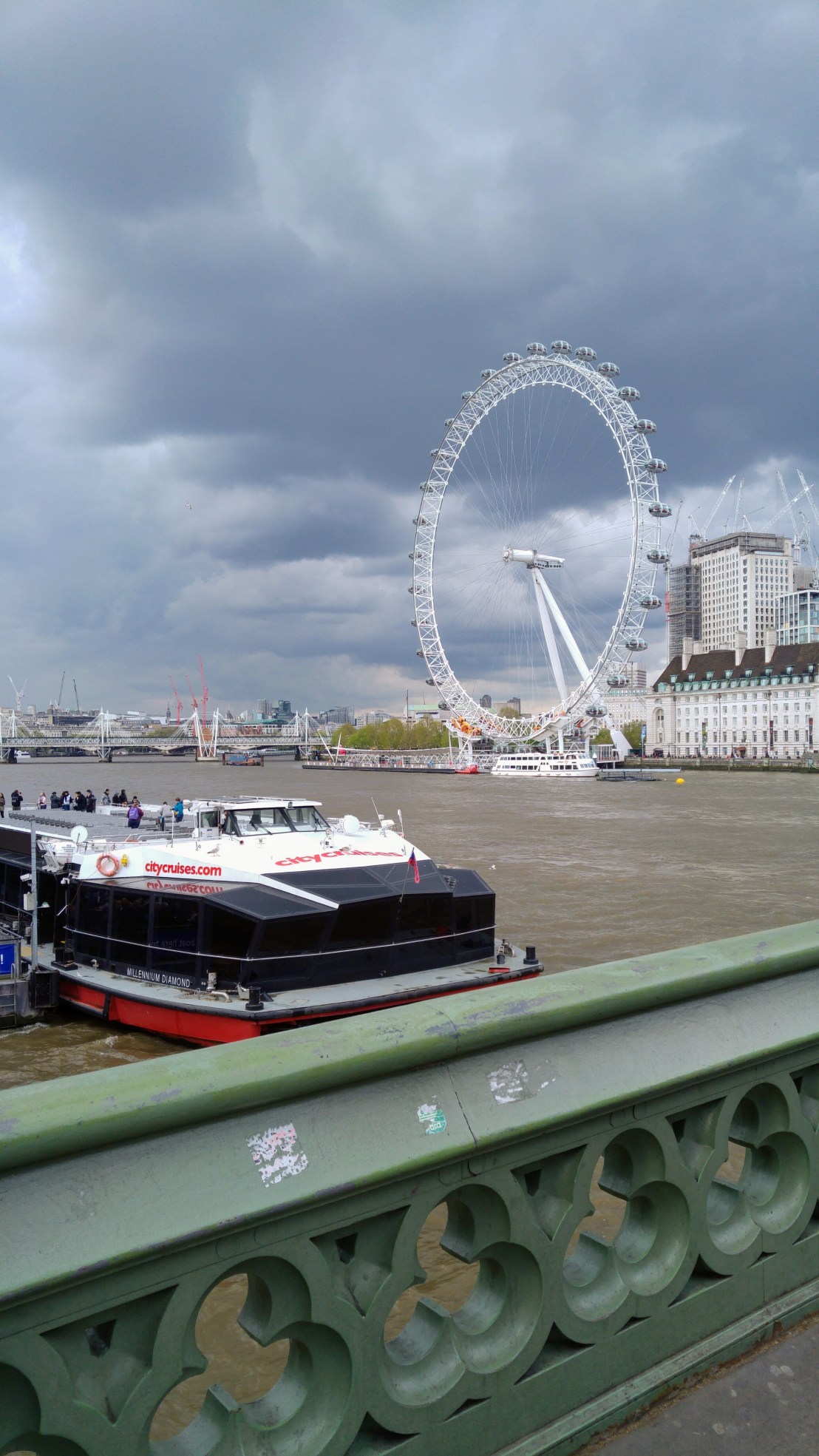A view from Westminster bridge onto London Eye ferris wheel