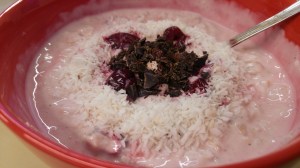 Cherry and coconut porridge in a bowl
