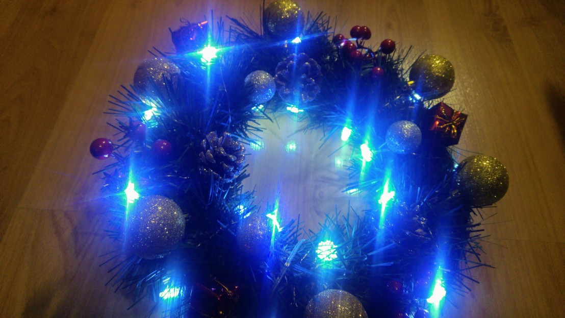 Finished DIY Christmas wreath with lit up lights