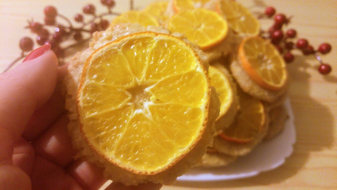 A baked cookie with a slice of tangerine