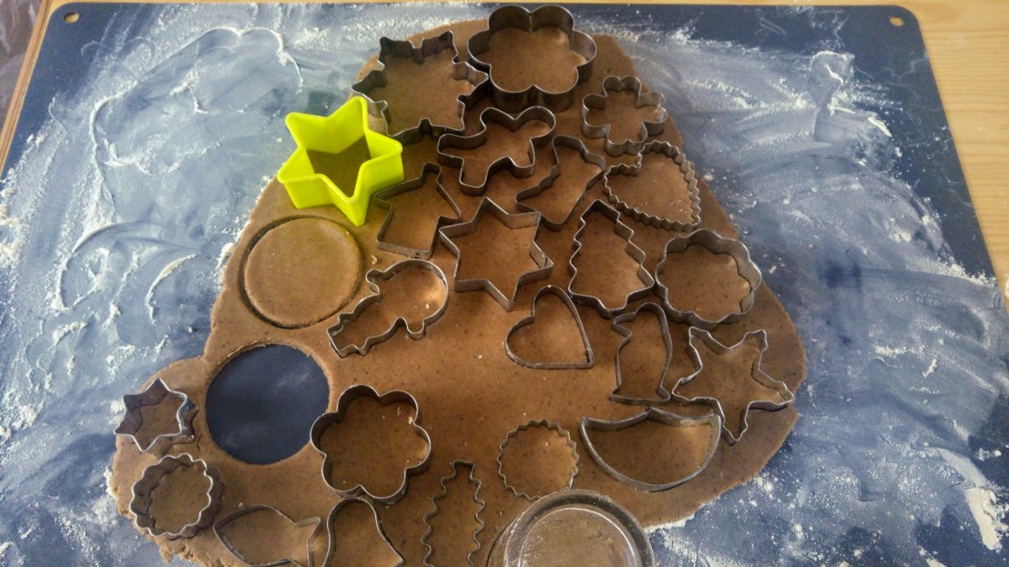 Gingerbread cookies being cut out