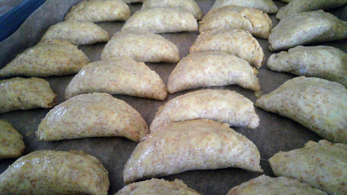 Oven baked dumplings, on a baking tray