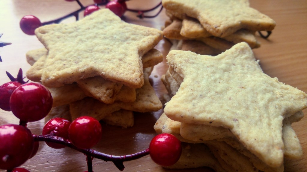 A few piles of star shaped Christmas walnut cookies