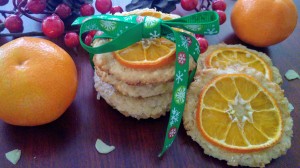A batch of cookies with slices of tangerine