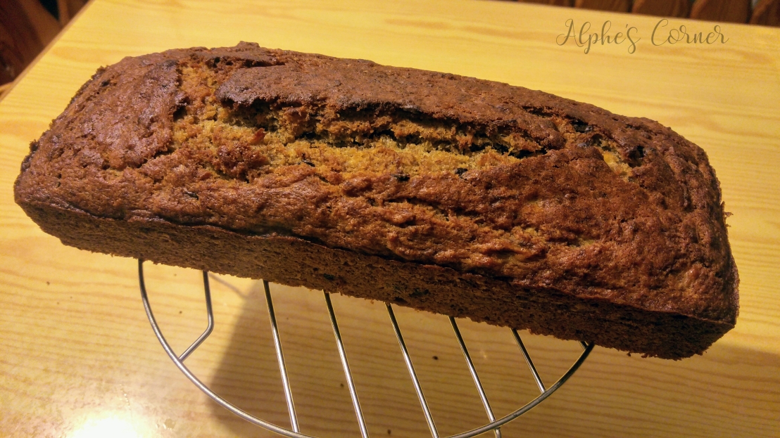 A loaf of banana bread on a cooling rack