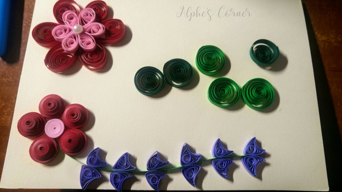 Two flowers on the base card and green circles for leaves