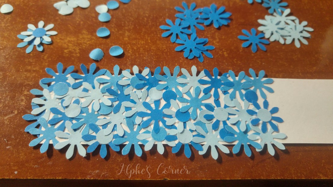 Simple DIY flower bookmarks - glueing the flowers onto a piece of paper