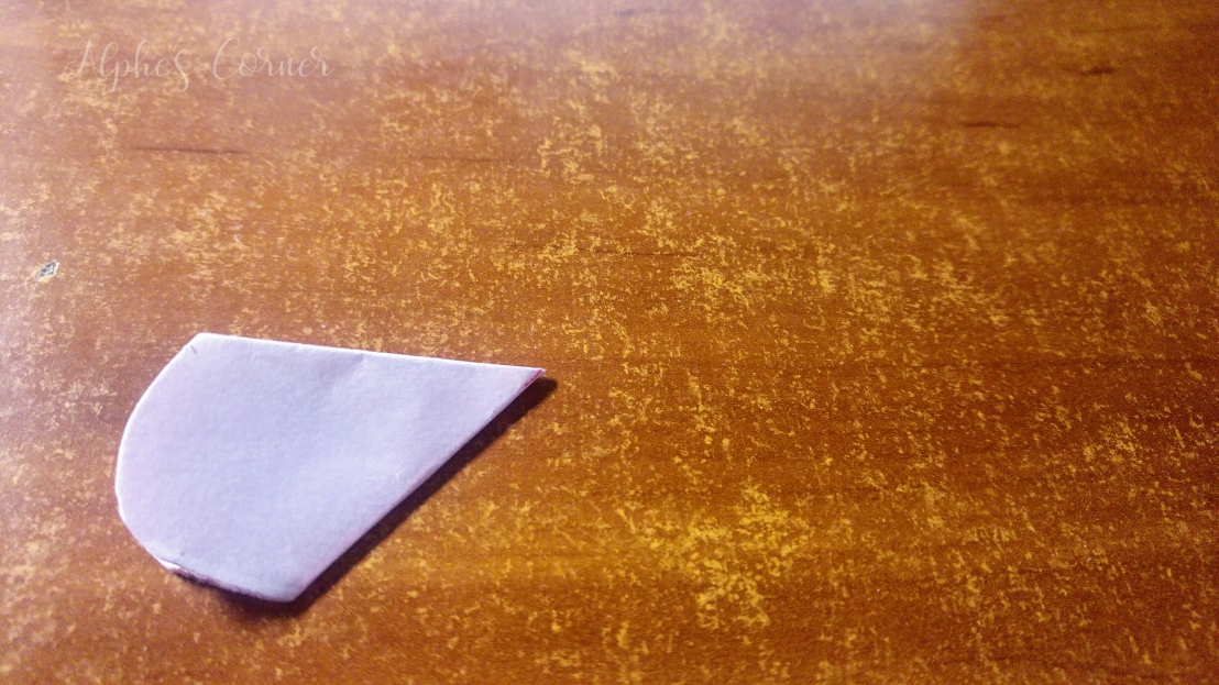 Folded piece of paper cut to petal shape