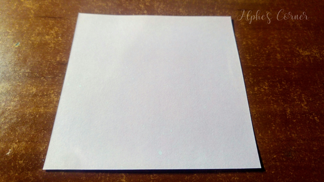 A square piece of white paper