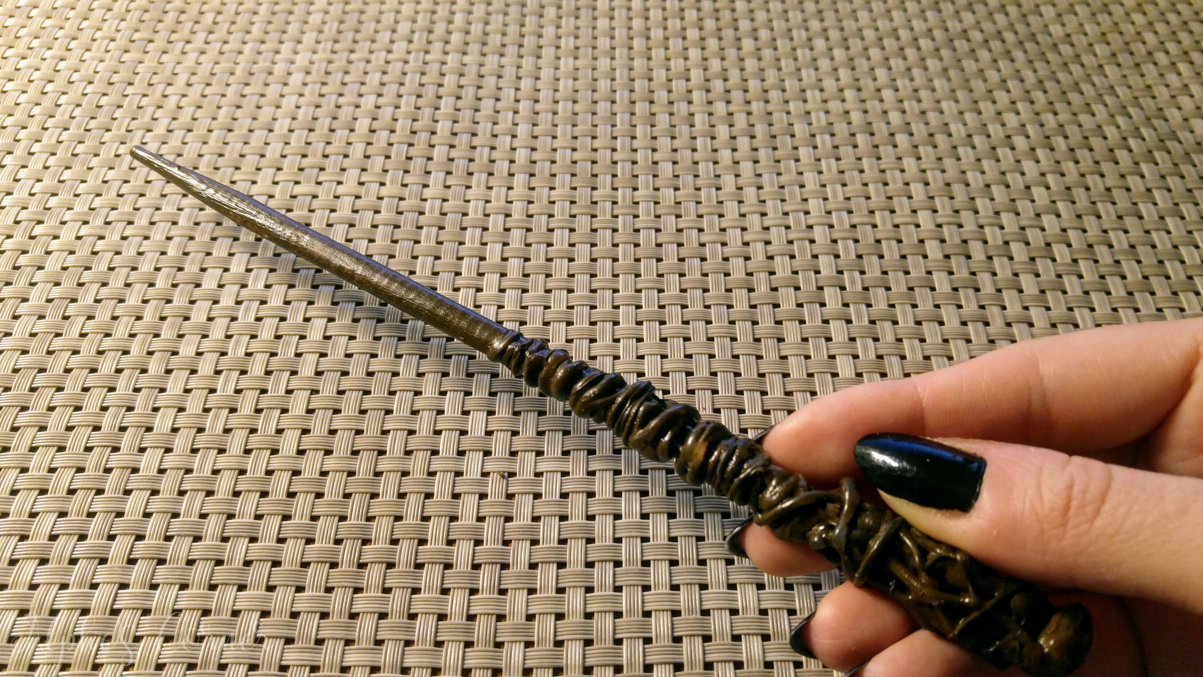 Holding a DIY Harry Potter wand