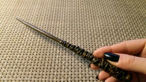 Holding a DIY Harry Potter wand