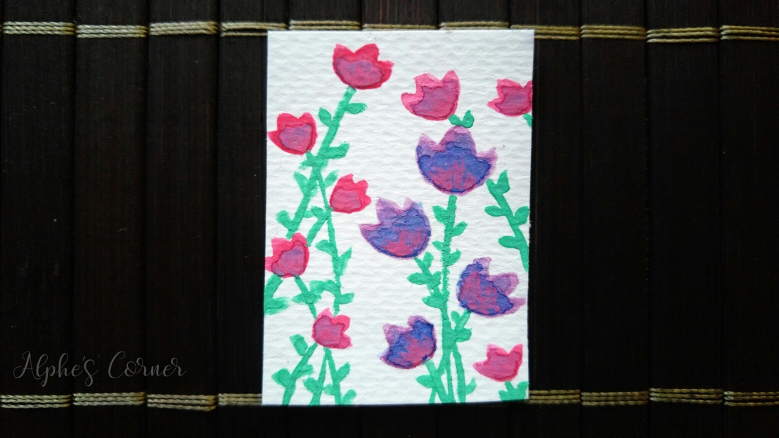 A small tag with purple and pink tulips