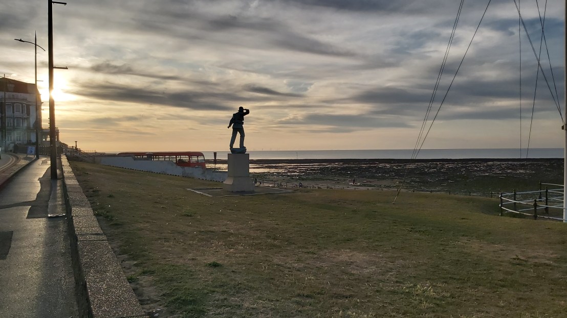 A mysterious statue on the beach in Margate, at sunset
