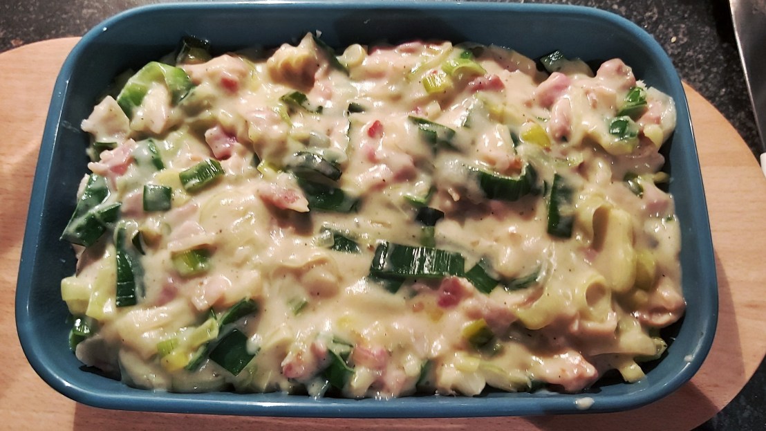 Chicken and the bacon and leek sauce in a dish