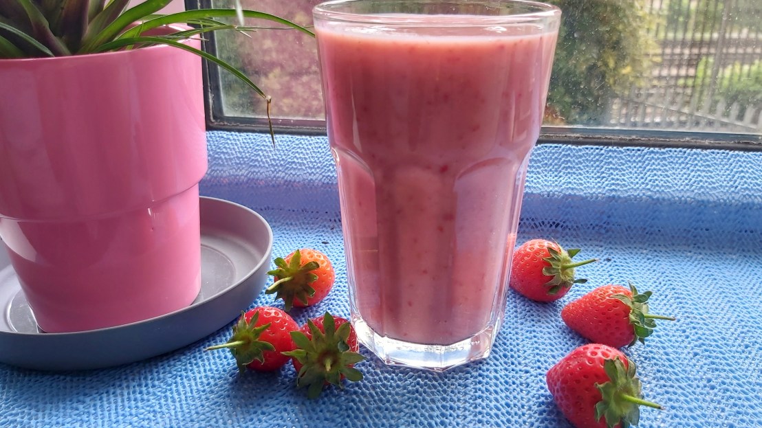 Banana strawberry milkshake in a glass
