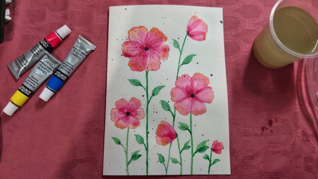 A birthday card with neon pink watercolour poppies