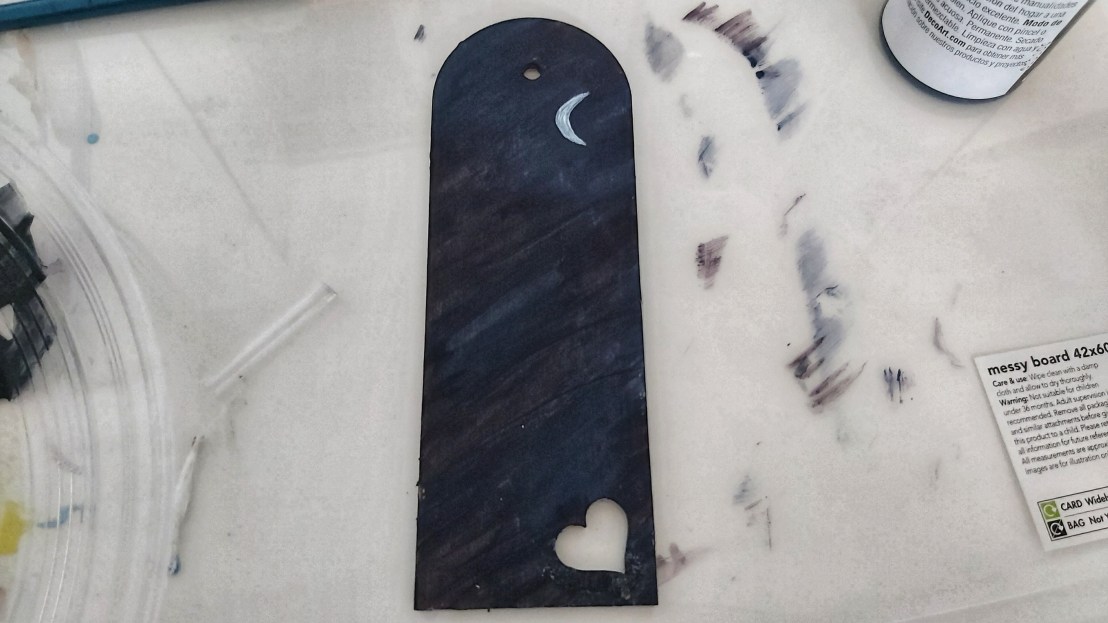 Wooden bookmark painted in dark blue and black