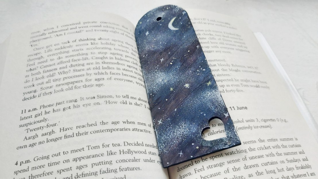 Midnight wooden bookmark - in a book