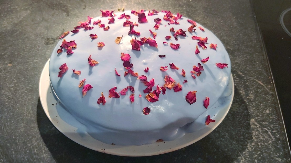 Red velvet cake with blue, strawberry frosting