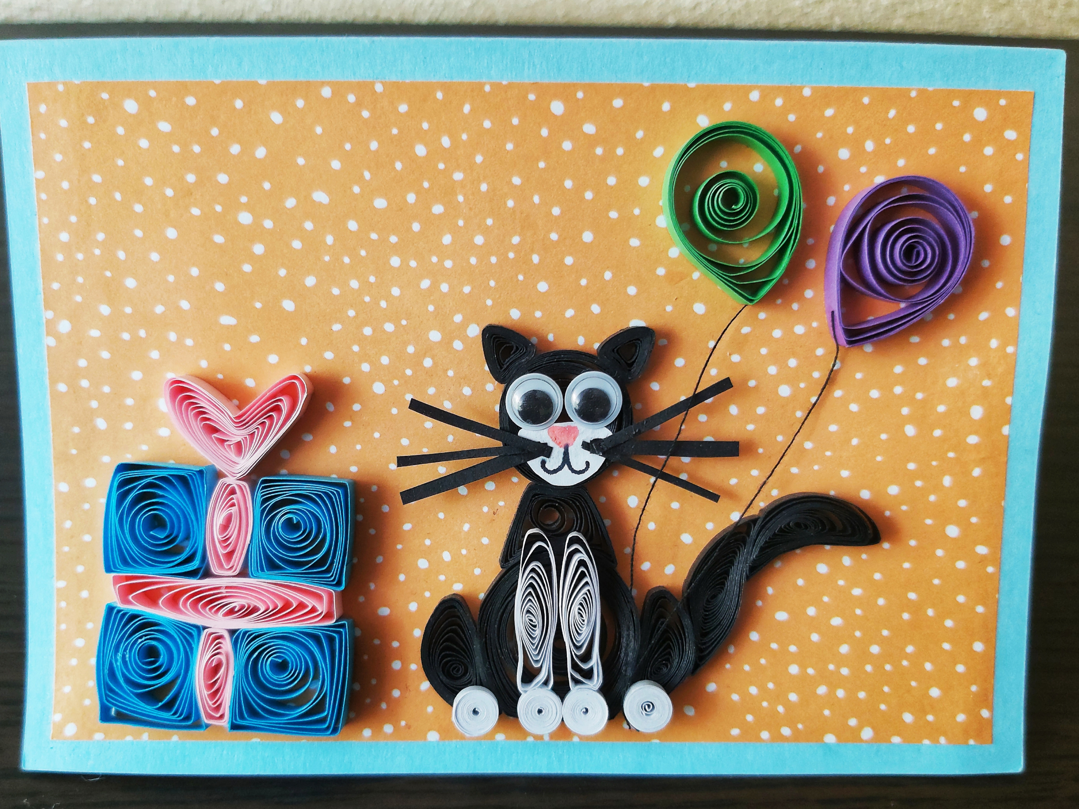 Handmade quilling card - cat with a gift and balloons