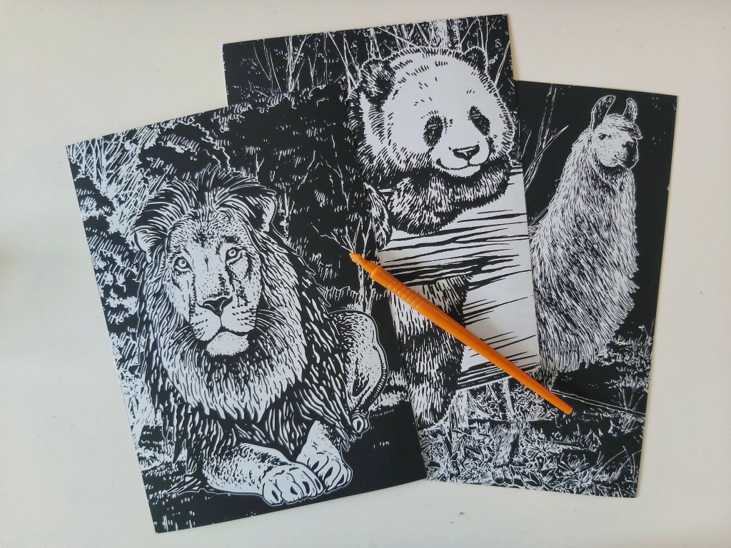 Three holographic scratch pages for adults. A lion, a panda and a llama.