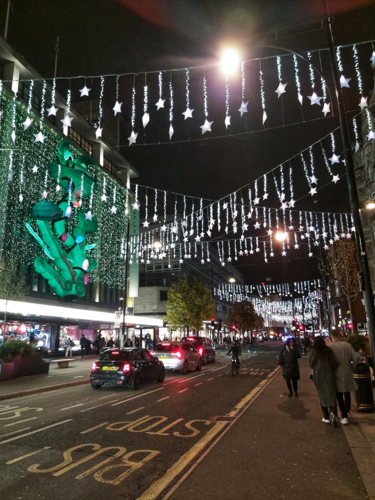 White stars hanging over Oxford Street, London.