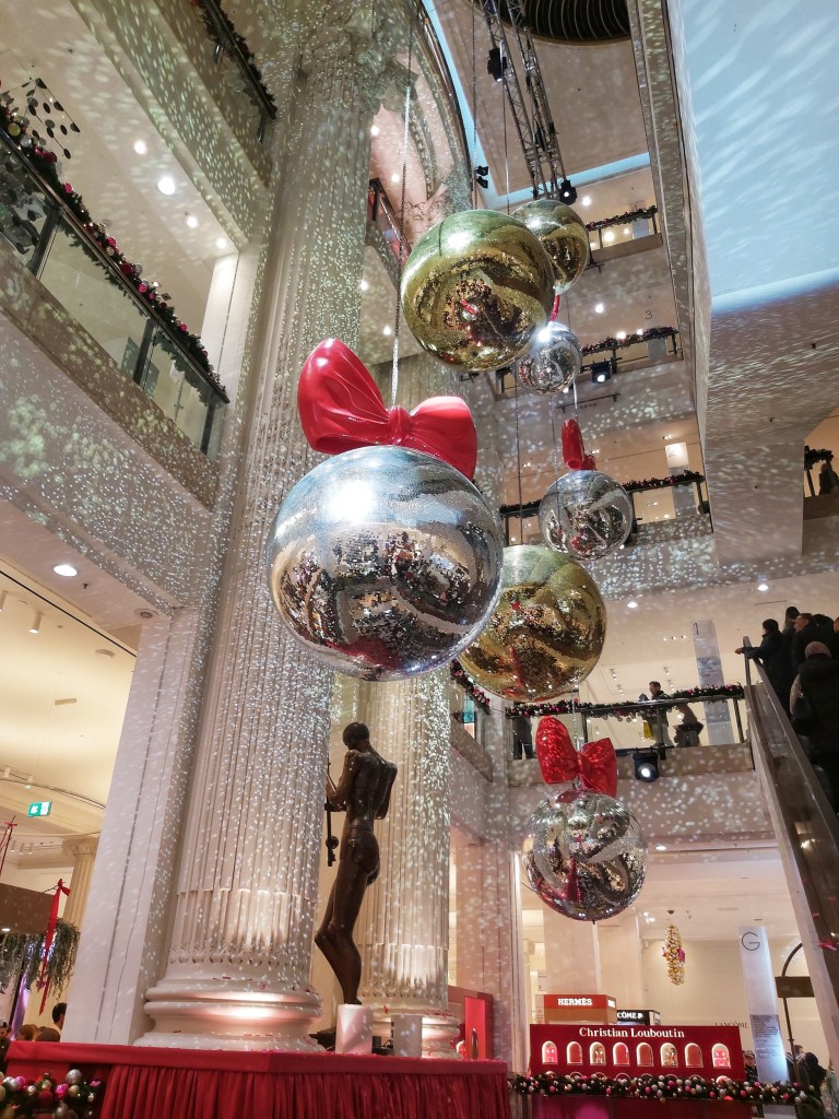 Giant disco balls with red bows in Selfridges department store