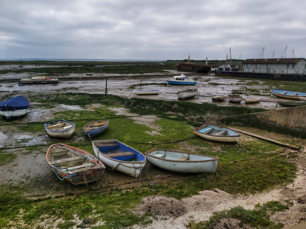 Post-apocalyptic view on my walk from Southend-on-Sea to Hadleigh Castle. Old boats sat on a dry river bed covered with seaweed and moss.