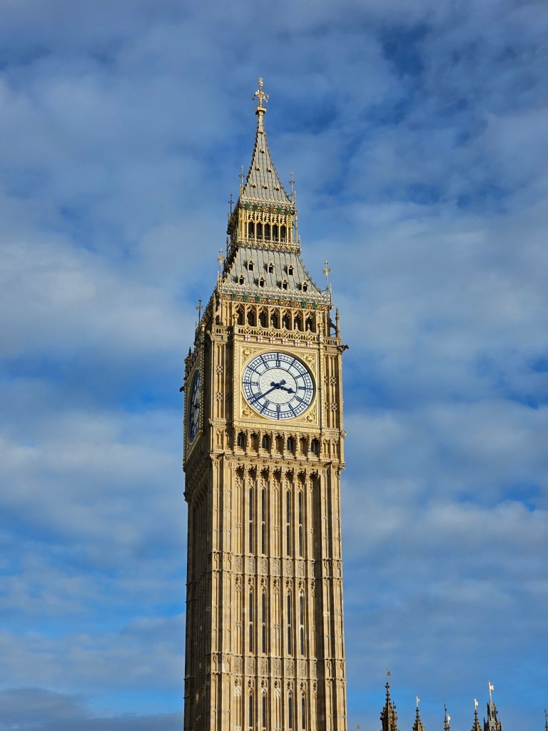 London Big Ben and blue skies in the background.
