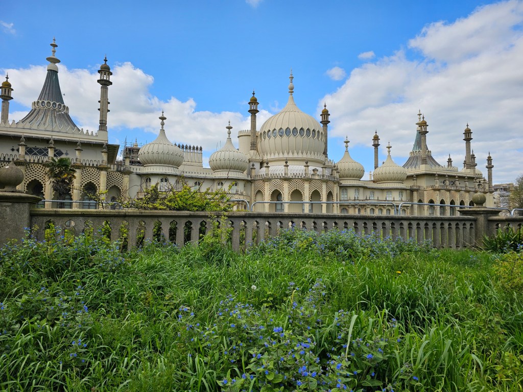 Royal Pavilion - Brighton Palace. Photo taken from the outside. Green grass surrounding the Palace.