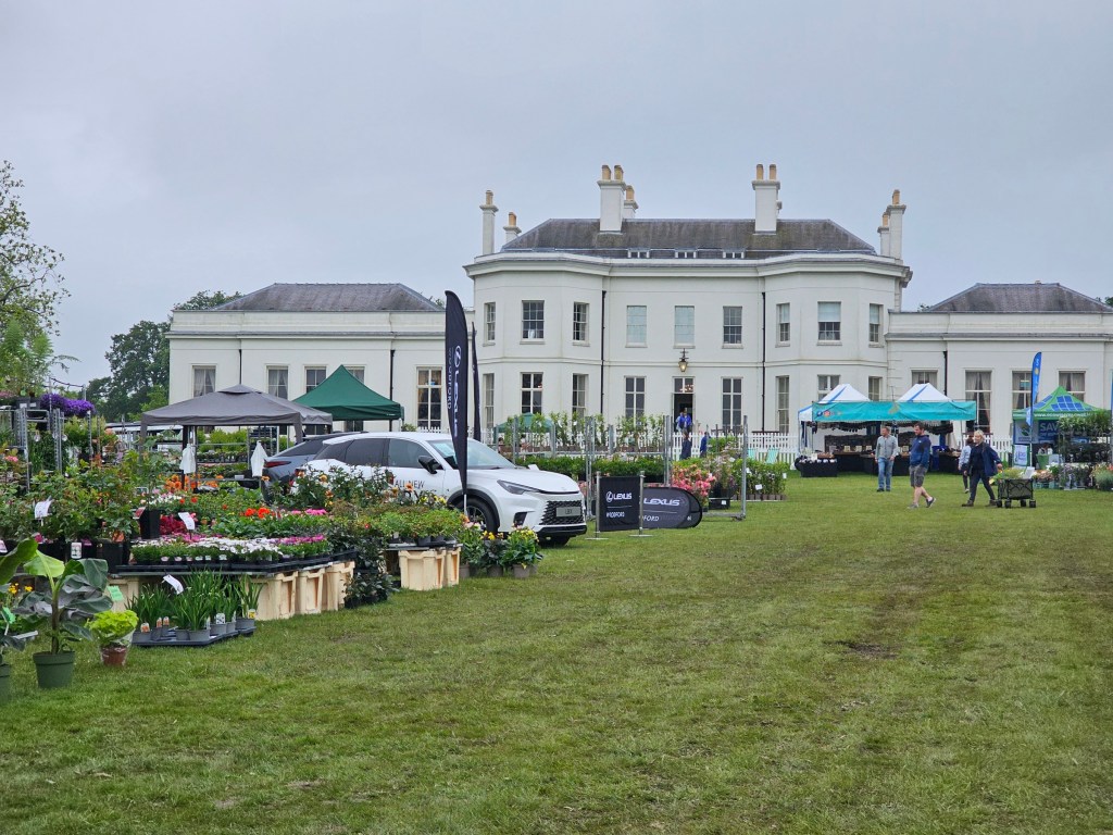 Garden fair stalls in front of Hylands House.