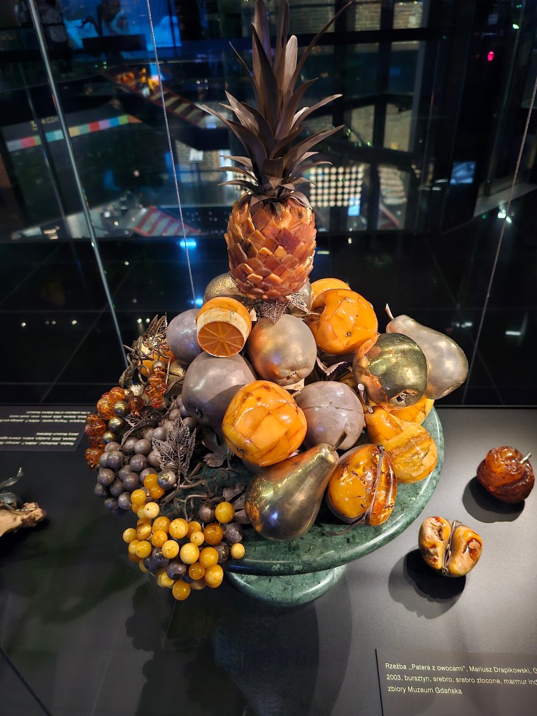 A beautiful sculpture depicting fruits: grapes, pears and apples. Some of the fruits are made of Baltic Amber.