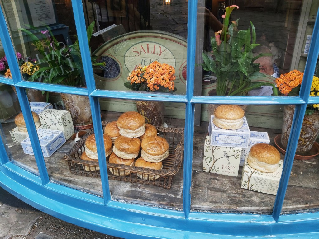 A window display of traditional Sally Lunn Buns in Bath.