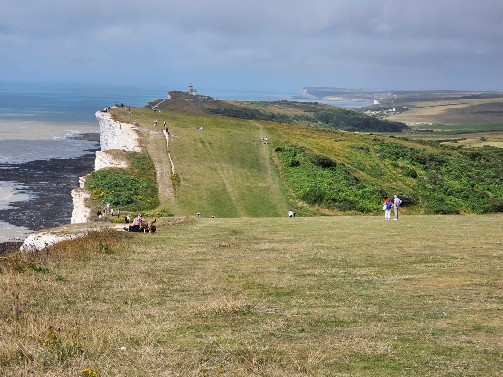 A view from Beachy Head towards the Seven Sisters cliffs.