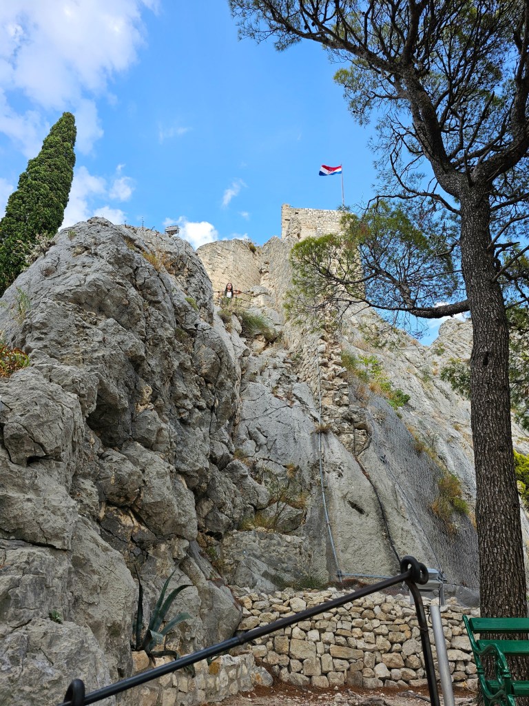 The highest tower of Mirabela Fortress in Omiš, Croatia. Croatian flag is flying on the mast on top of the tower.