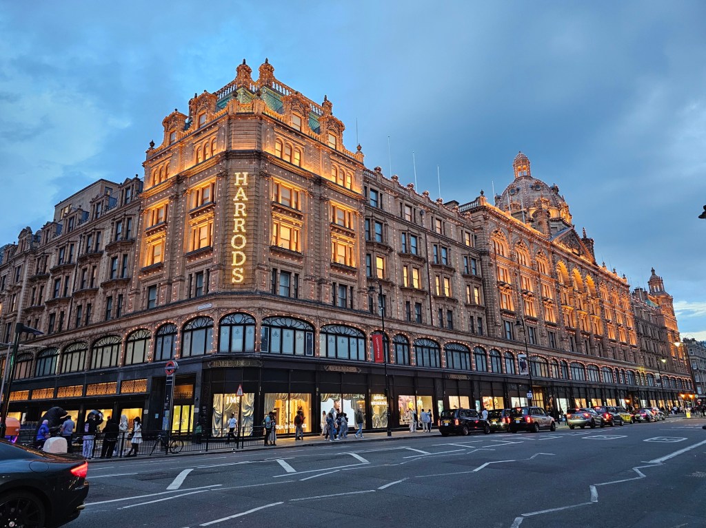 Illuminated Harrods department store, London.