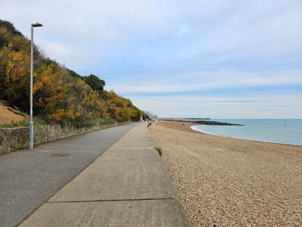 The beach path and the sea in Folkestone, England, during autumn.