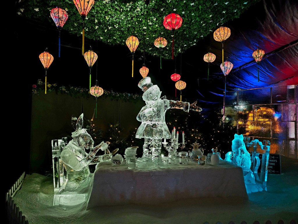 Ice sculptures in the Magical Ice Kingdom in Winder Wonderland. The sculptures depict the tea party scene from Alice in Wonderland.