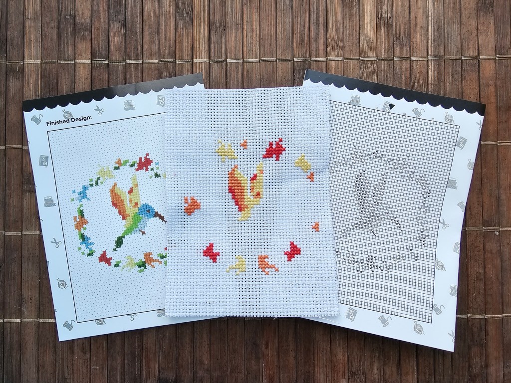 The first blocks for a mini hummingbird cross stitch design.