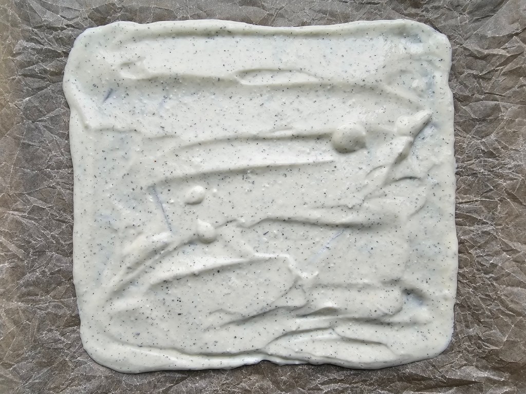 Batter for gluten free high protein wrap, spread on greaseproof paper.