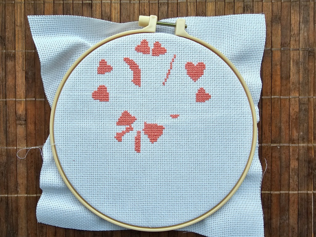 Barely started Easter bunny cross stitch design. The pink hearts are sewn.