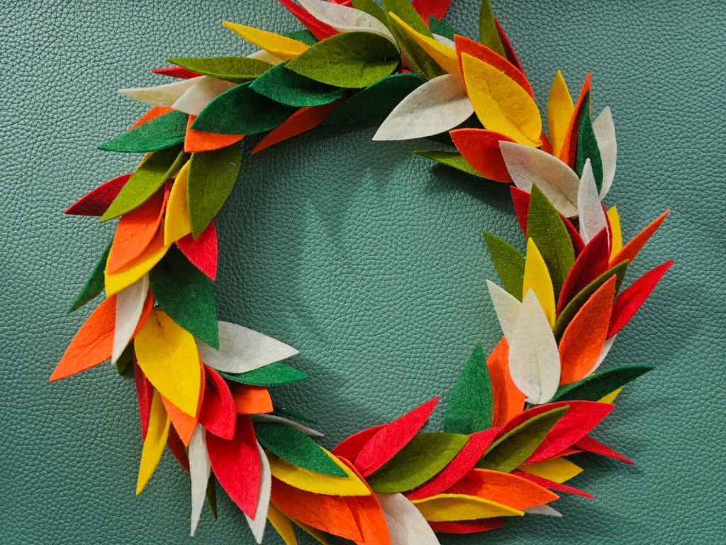 Nearly finished DIY floral wreath with felt flowers. The base is done.