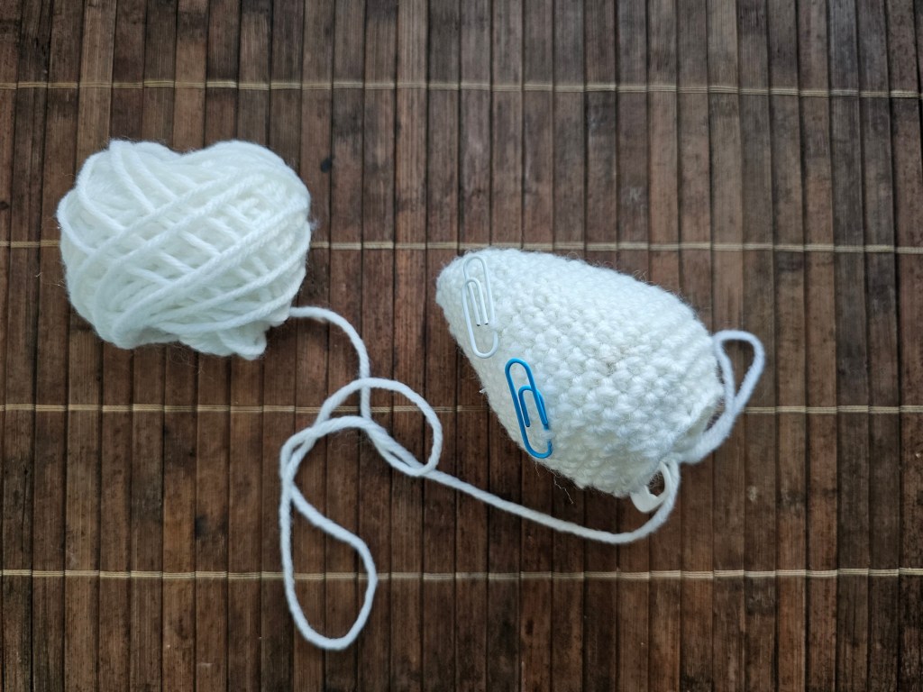 A white crochet Easter egg in progress