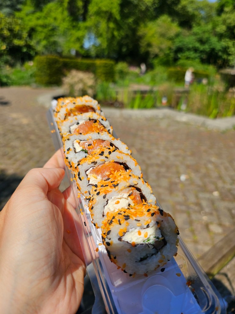 A tray with smoked salmon dragon rolls