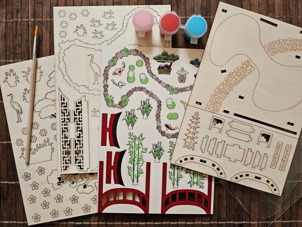 The contents of a DIY modelling set for making a Japanese garden