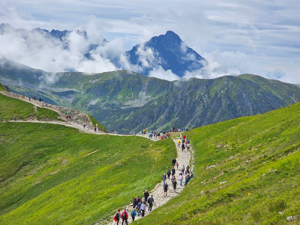 A path at the top of Kasprowy Wierch. Other mountains visible in the background.
