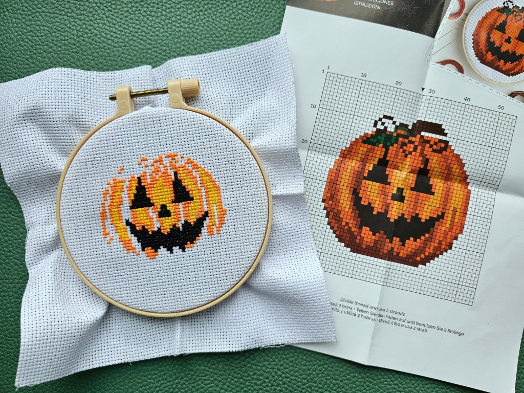 Partly completed Jack-o'-lantern cross stitch design