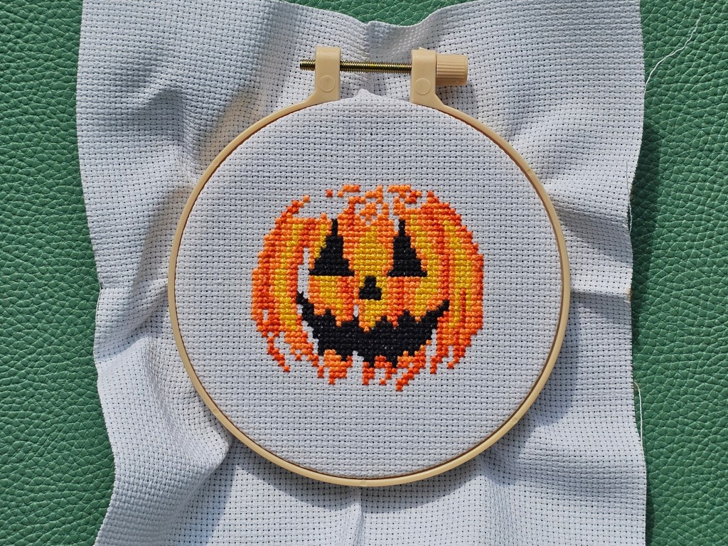 Partly completed Jack-o'-lantern cross stitch design