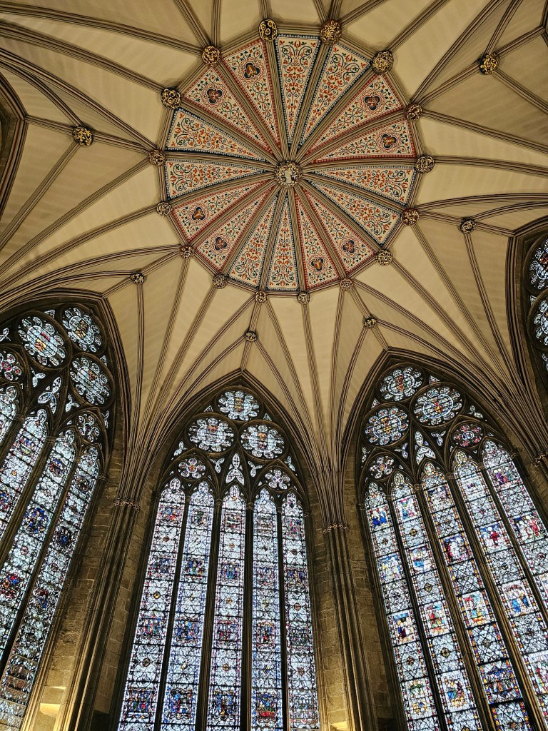 Tall stained glass windows in chapter house in York Minster