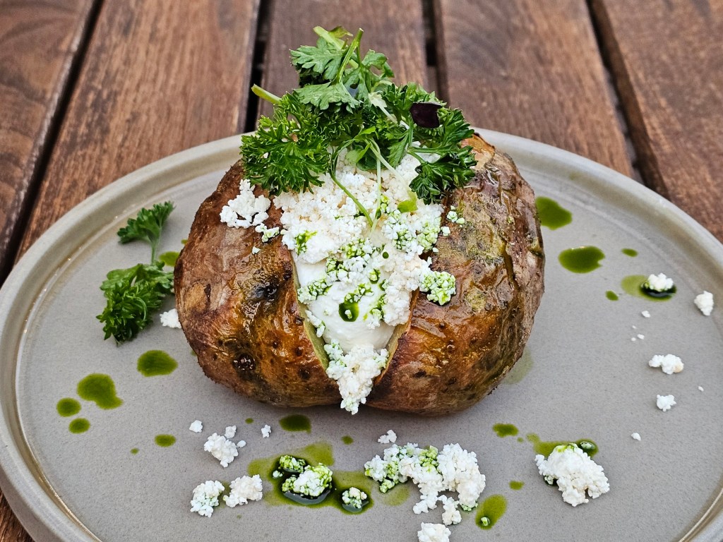 Jacket potato topped with regional smoked cheese - gzik